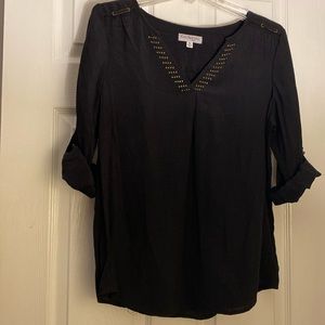 Black 3/4 length sleeve v-neck blouse with metal details. Petite medium